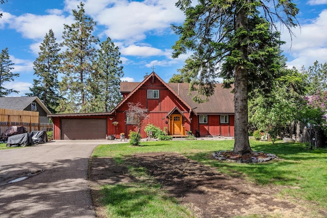 33893 Redgate Dr, Bigfork, MT 59911 - view of front of property featuring asphalt driveway and a garage