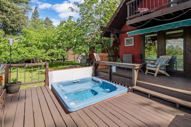 33893 Redgate Dr, Bigfork, MT 59911 - wooden deck featuring a covered hot tub