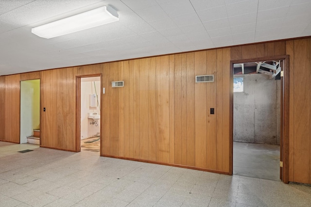 2015 Tower St, Missoula, MT 59804 - empty room featuring tile patterned floors and wood walls