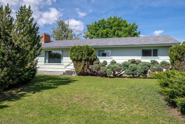 2015 Tower St, Missoula, MT 59804 - ranch-style home with a front yard and a chimney