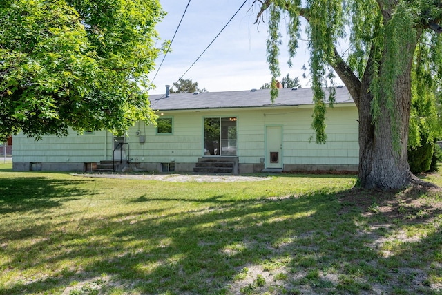 2015 Tower St, Missoula, MT 59804 - back of house featuring entry steps and a yard