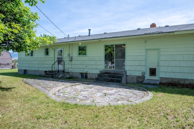 2015 Tower St, Missoula, MT 59804 - rear view of house featuring entry steps and a yard