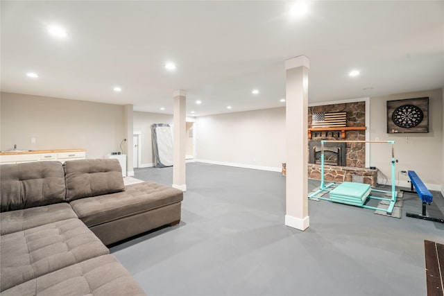 1296 Bighorn Rd, Helena, MT 59602 - living area with baseboards, a stone fireplace, recessed lighting, and finished concrete floors