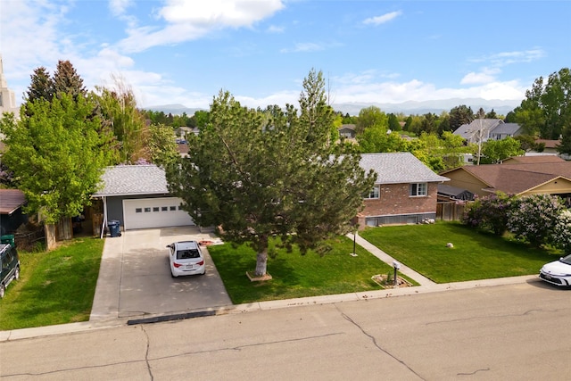 1296 Bighorn Rd, Helena, MT 59602 - view of front of property featuring driveway, a mountain view, a garage, and brick siding