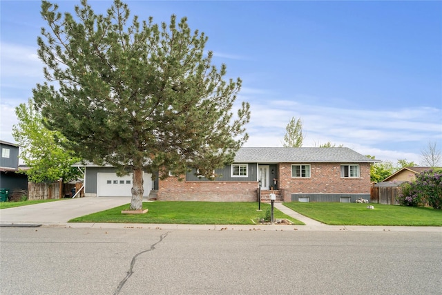 1296 Bighorn Rd, Helena, MT 59602 - view of front facade with concrete driveway, brick siding, and an attached garage