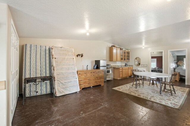 151 6th Ln NE, Fairfield, MT 59436 - dining space featuring lofted ceiling and dark flooring