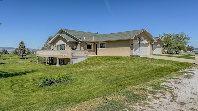 4134 Fox Ridge Dr, Helena, MT 59602 - view of front of property featuring stucco siding, a front lawn, concrete driveway, and an attached garage
