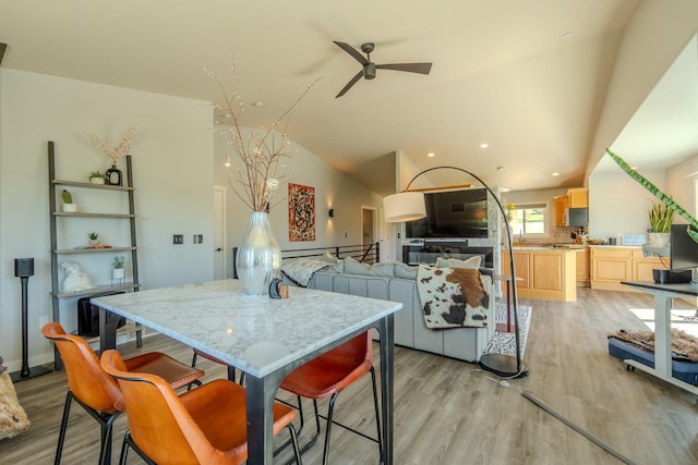4134 Fox Ridge Dr, Helena, MT 59602 - kitchen with light brown cabinetry, a ceiling fan, light wood-style flooring, lofted ceiling, and recessed lighting