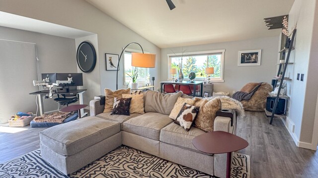 4134 Fox Ridge Dr, Helena, MT 59602 - living area with wood finished floors, lofted ceiling, ceiling fan, and baseboards