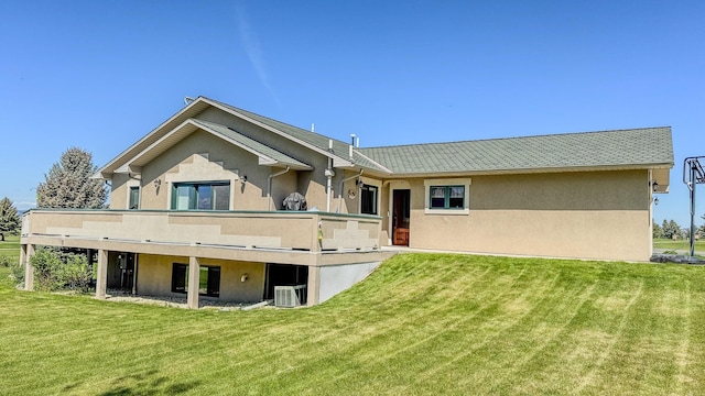 4134 Fox Ridge Dr, Helena, MT 59602 - rear view of property with stucco siding and a lawn