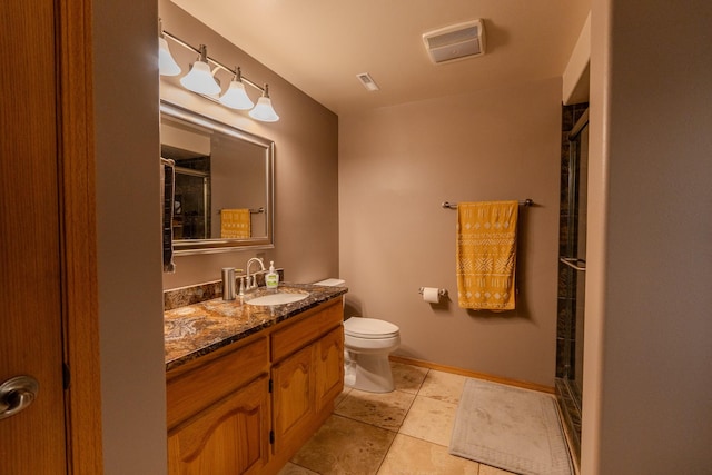 4134 Fox Ridge Dr, Helena, MT 59602 - bathroom with an enclosed shower, vanity, toilet, tile patterned flooring, and baseboards