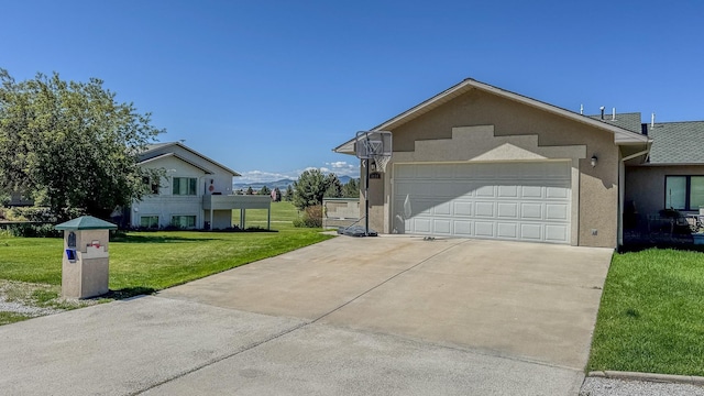 4134 Fox Ridge Dr, Helena, MT 59602 - view of front of property with a front lawn, driveway, stucco siding, and a garage