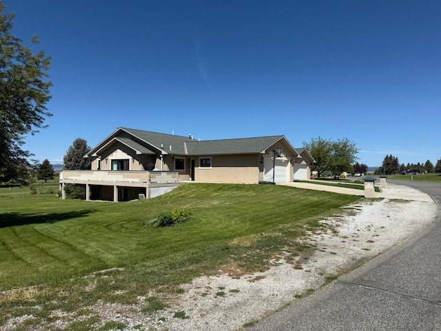 4134 Fox Ridge Dr, Helena, MT 59602 - view of side of home featuring driveway, a garage, and a yard
