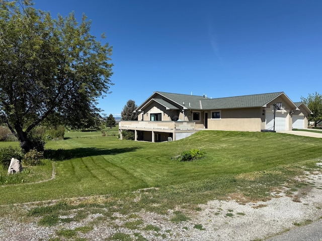 4134 Fox Ridge Dr, Helena, MT 59602 - view of side of property featuring an attached garage, a lawn, and driveway