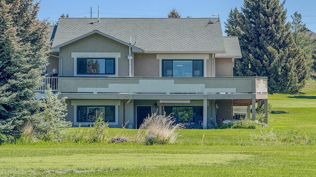 4134 Fox Ridge Dr, Helena, MT 59602 - view of front of home with stucco siding and a front yard