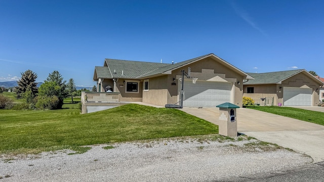4134 Fox Ridge Dr, Helena, MT 59602 - single story home with stucco siding, a front lawn, a garage, and concrete driveway