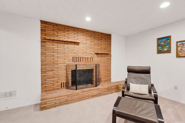 630 Woodworth Ave, Missoula, MT 59801 - sitting room with carpet floors, a brick fireplace, and recessed lighting