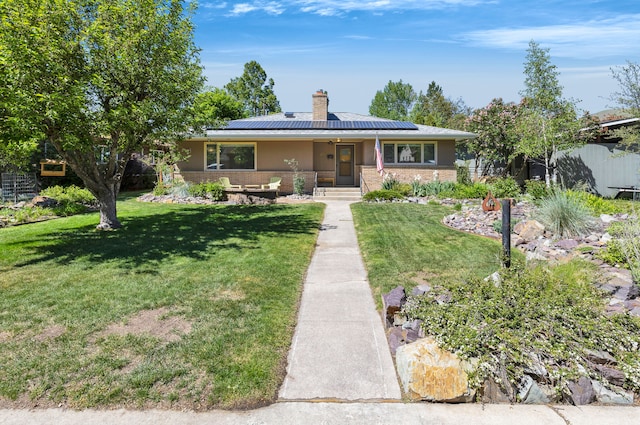 630 Woodworth Ave, Missoula, MT 59801 - view of front of house featuring a front lawn, solar panels, a chimney, and a porch