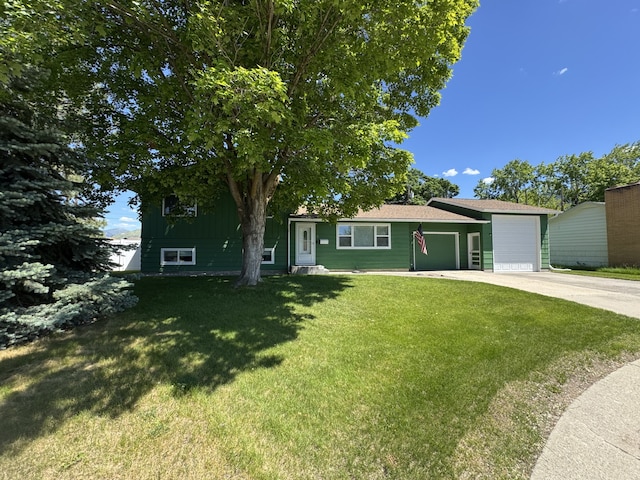 3 Rosebud Ln, Missoula, MT 59801 - view of front facade featuring concrete driveway, an attached garage, and a front yard