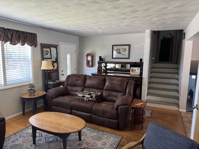 3 Rosebud Ln, Missoula, MT 59801 - living area with stairs, wood finished floors, baseboards, and a textured ceiling