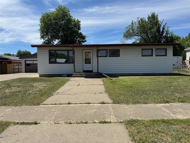 1030 Washington Ave, Havre, MT 59501 - ranch-style home with a front lawn and a garage