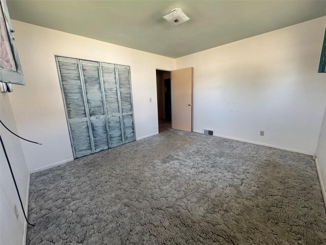 1030 Washington Ave, Havre, MT 59501 - unfurnished bedroom with carpet, baseboards, and a closet