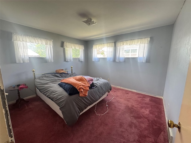 1030 Washington Ave, Havre, MT 59501 - bedroom with multiple windows, carpet, and baseboards