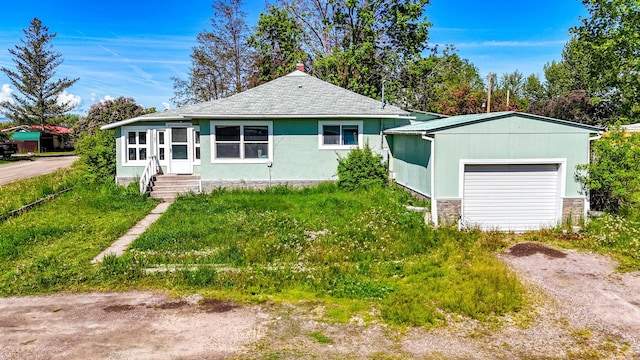 107 7th Ave NW, Ronan, MT 59864 - view of front of house with entry steps and a garage