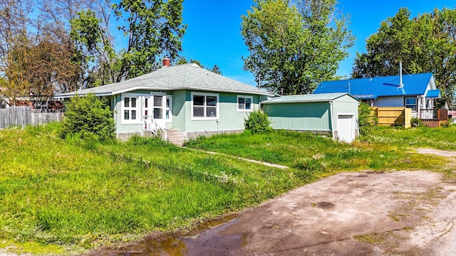 107 7th Ave NW, Ronan, MT 59864 - bungalow-style house with entry steps and an outbuilding