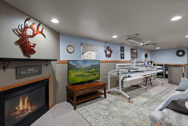 36 Winchester St, Kalispell, MT 59901 - living room with a glass covered fireplace, carpet, and recessed lighting