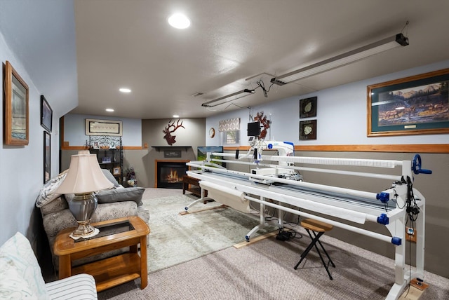 36 Winchester St, Kalispell, MT 59901 - misc room with recessed lighting, carpet flooring, and a glass covered fireplace