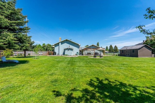 36 Winchester St, Kalispell, MT 59901 - rear view of house with a gazebo and an outdoor structure