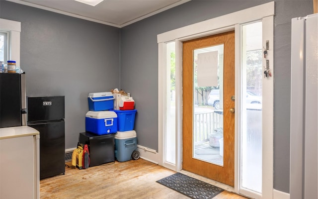 831 Hastings Ave, Missoula, MT 59801 - entryway with wood finished floors, ornamental molding, and baseboards