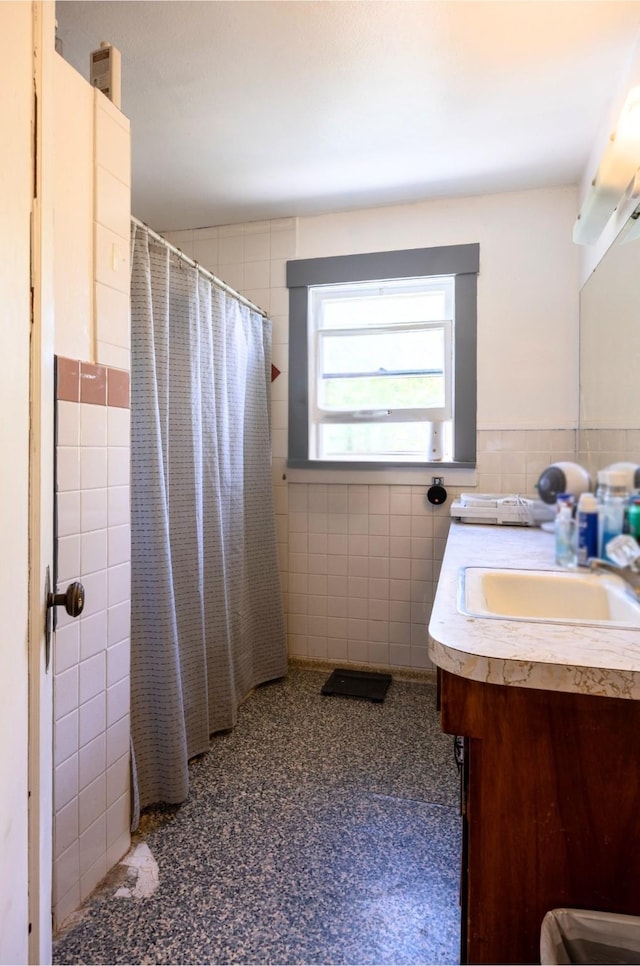 831 Hastings Ave, Missoula, MT 59801 - bathroom featuring tile walls, vanity, curtained shower, toilet, and wainscoting