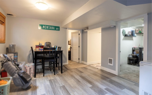 831 Hastings Ave, Missoula, MT 59801 - dining room featuring wood finished floors, heating unit, and baseboards
