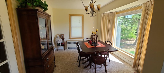 225 4th Ave SE, Dutton, MT 59433 - dining area with radiator, carpet flooring, a chandelier, and plenty of natural light