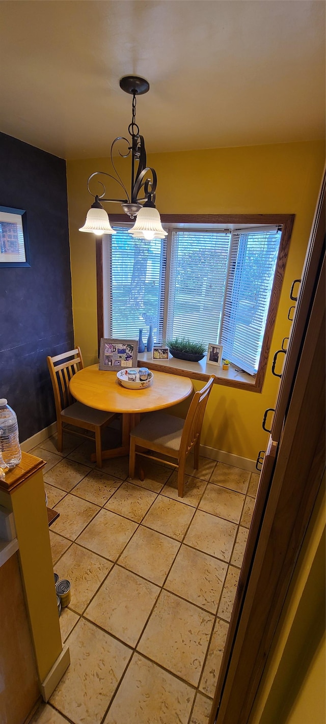 225 4th Ave SE, Dutton, MT 59433 - dining area featuring a chandelier and baseboards