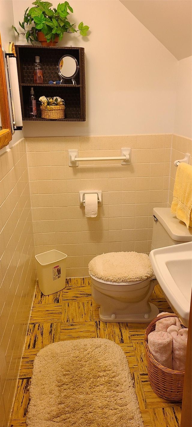 225 4th Ave SE, Dutton, MT 59433 - half bath featuring tile walls and wainscoting