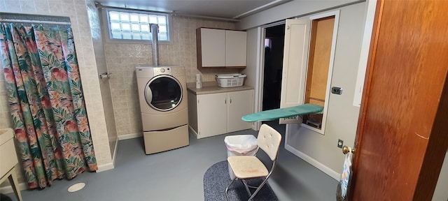 225 4th Ave SE, Dutton, MT 59433 - washroom featuring cabinet space and washer / clothes dryer
