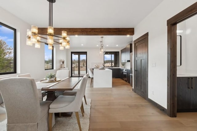 1942 Whitefish Ave, Whitefish, MT 59937 - dining space with beam ceiling, a chandelier, light wood-style floors, and recessed lighting