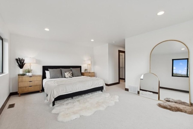 1942 Whitefish Ave, Whitefish, MT 59937 - bedroom with light carpet, recessed lighting, and multiple windows