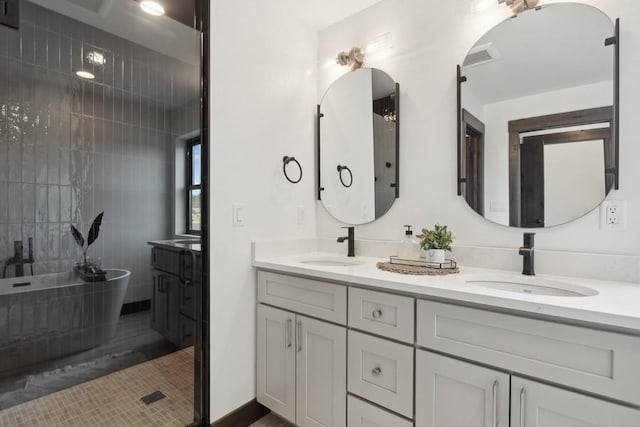 1942 Whitefish Ave, Whitefish, MT 59937 - full bathroom with double vanity, a freestanding bath, tile patterned floors, and a shower
