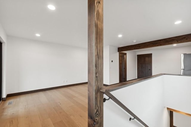 1942 Whitefish Ave, Whitefish, MT 59937 - hallway featuring recessed lighting, light wood-style flooring, and an upstairs landing