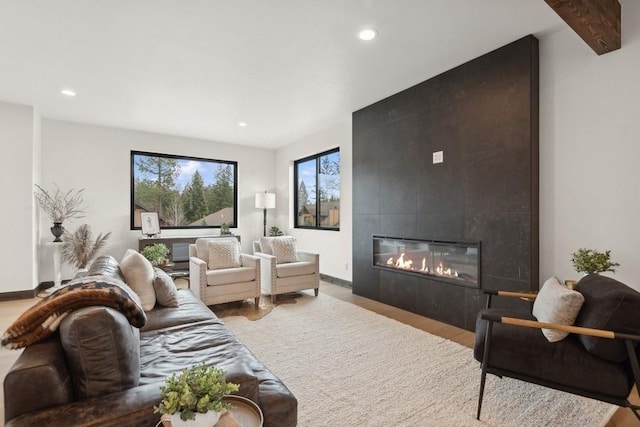 1942 Whitefish Ave, Whitefish, MT 59937 - living room featuring wood finished floors, recessed lighting, and a tiled fireplace