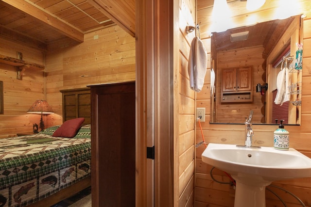 589 Summit Dr, Seeley Lake, MT 59868 - bathroom featuring wood walls and a wood ceiling with exposed beams