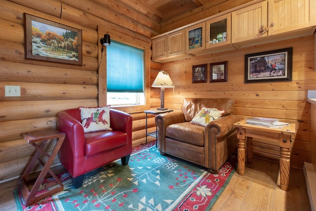 589 Summit Dr, Seeley Lake, MT 59868 - living area with rustic walls, light wood-style floors, and wooden ceiling