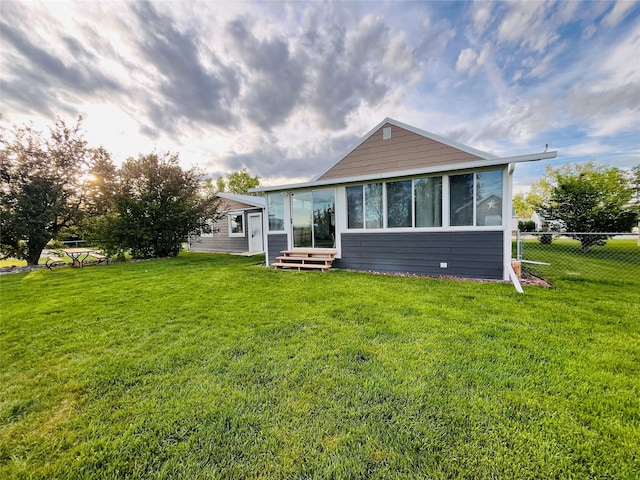 502 Illinois Ave, Valier, MT 59486 - back of house featuring a sunroom