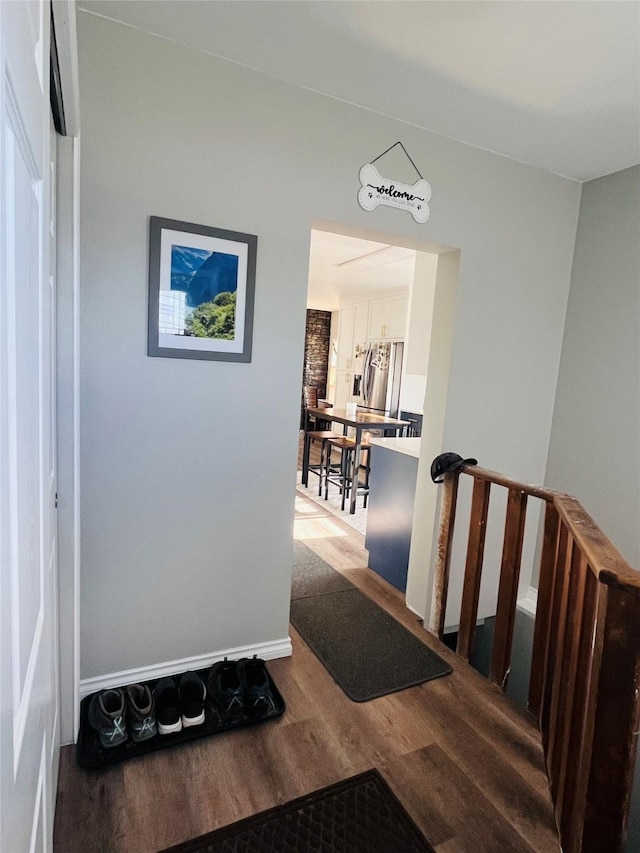 502 Illinois Ave, Valier, MT 59486 - hall featuring wood finished floors and an upstairs landing