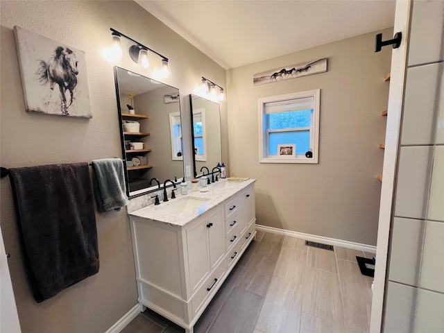 502 Illinois Ave, Valier, MT 59486 - bathroom featuring double vanity and baseboards