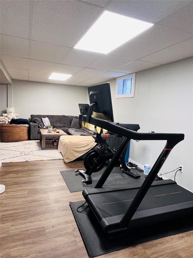 502 Illinois Ave, Valier, MT 59486 - exercise room featuring a paneled ceiling and wood finished floors